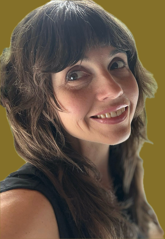 Sara McKee, digital designer, smiling in a studio setting